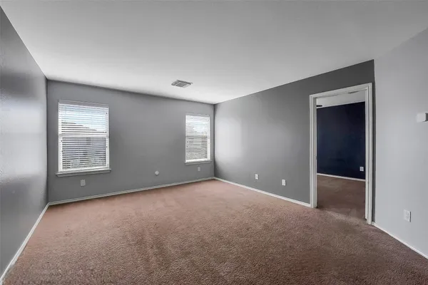 a kitchen with cabinets and stainless steel appliances