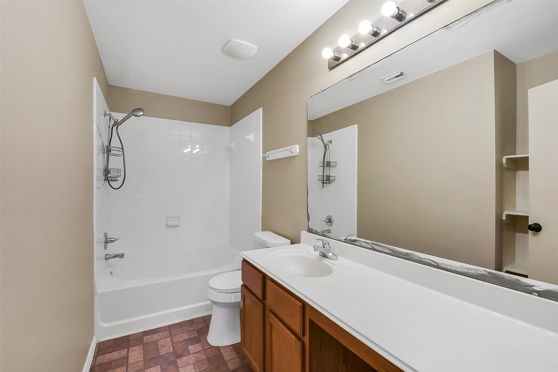20011 Spring Wreath Lane Cypress, TX 77433 - Photo 24 of 39 Full bathroom upstairs with an extended countertop, plenty of storage, and a tub/shower combo.