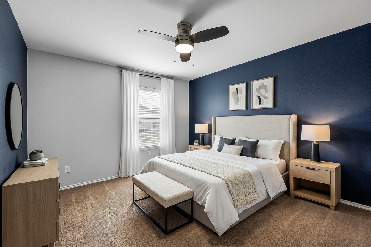 20011 Spring Wreath Lane Cypress, TX 77433 - Photo 27 of 39 Virtually staged secondary bedroom to show the potential, featuring a bold navy accent wall, cozy lighting, and a calm, modern feel.