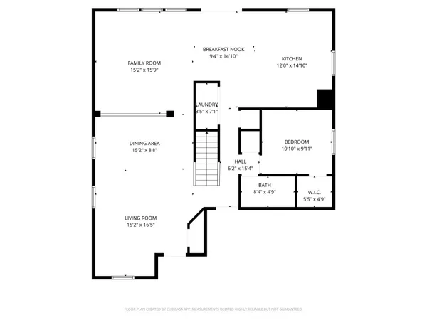an empty room with a window and a ceiling fan
