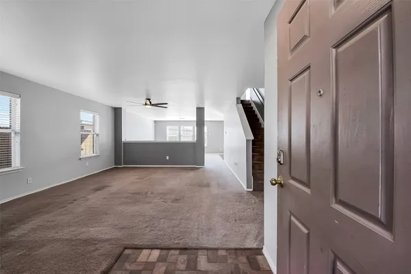 a view of a house with backyard and garden