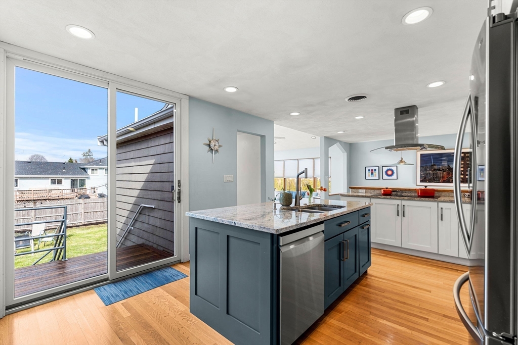 58 Leicester Road Marblehead, MA 01945 - Photo 15 of 42 a kitchen with a stove top oven sink and cabinets