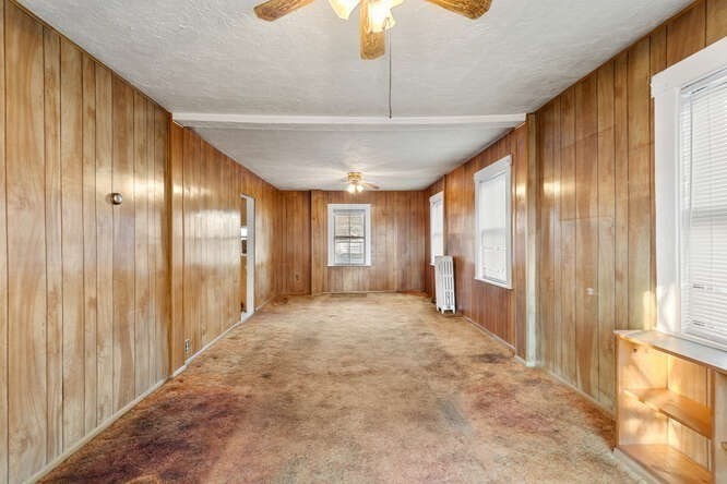13 Highland Street Wakefield, MA 01880 - Photo 13 of 35 a view of a hallway with windows