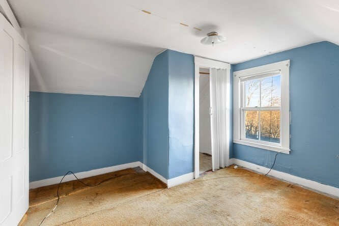 13 Highland Street Wakefield, MA 01880 - Photo 18 of 35 an empty room with windows and closet