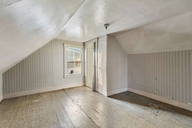 13 Highland Street Wakefield, MA 01880 - Photo 20 of 35 an empty room with wooden floor and windows