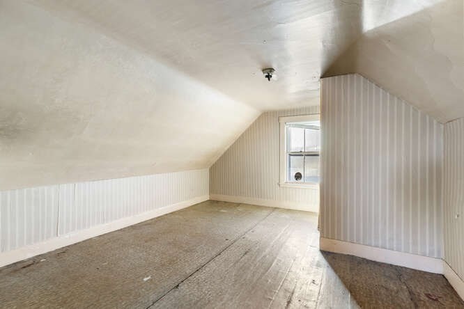 13 Highland Street Wakefield, MA 01880 - Photo 21 of 35 an empty room with wooden floor and windows
