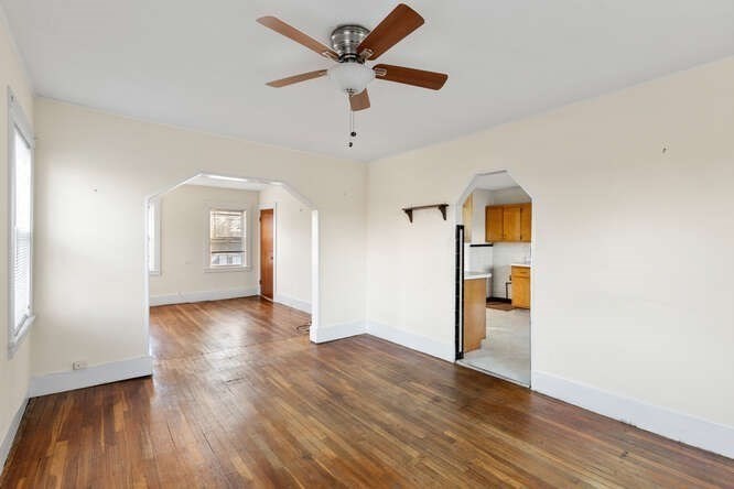 13 Highland Street Wakefield, MA 01880 - Photo 22 of 35 wooden floor in an empty room with a window