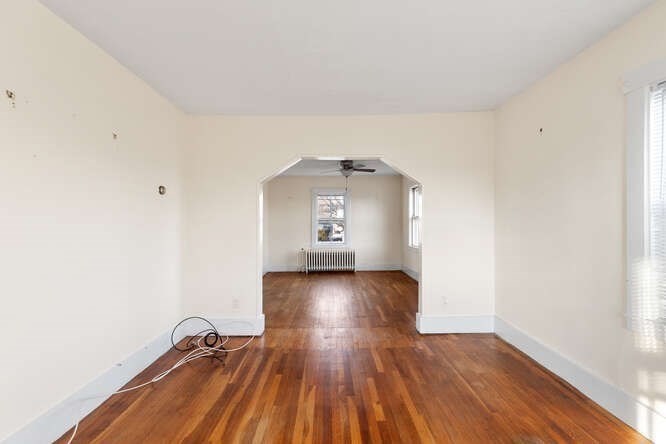 13 Highland Street Wakefield, MA 01880 - Photo 25 of 35 a view of a hallway with wooden floor