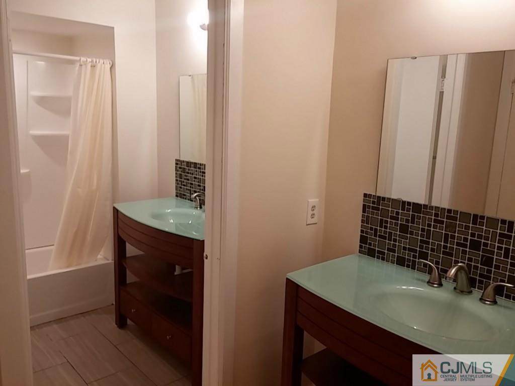 75 Park Gate Drive Edison, NJ 08820 - Photo 12 of 19 a bathroom with a sink and a mirror