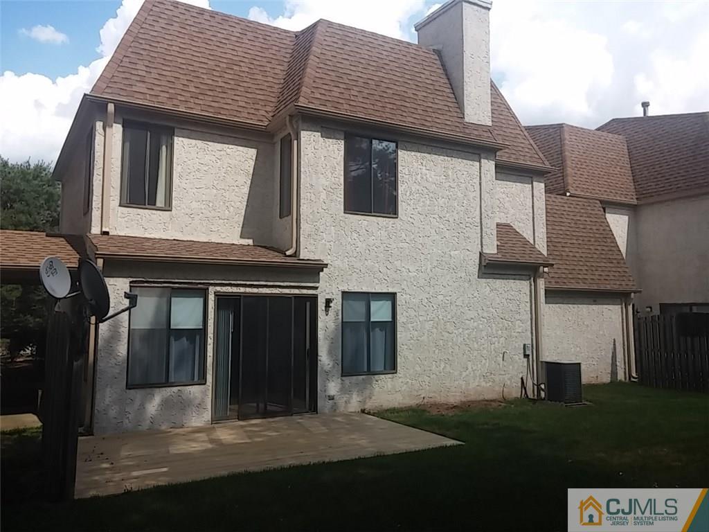 75 Park Gate Drive Edison, NJ 08820 - Photo 18 of 19 a front view of a house with a garden