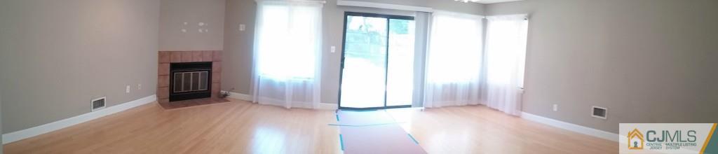 75 Park Gate Drive Edison, NJ 08820 - Photo 3 of 19 a view of a hallway with wooden floor