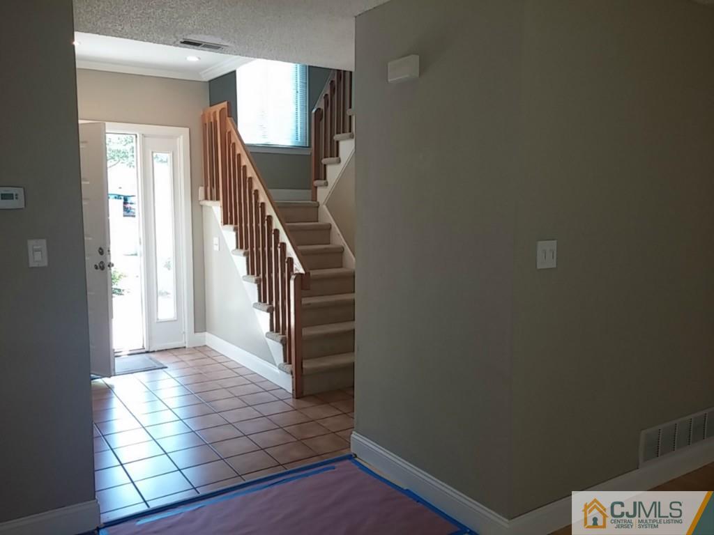 75 Park Gate Drive Edison, NJ 08820 - Photo 9 of 19 a view of an entryway with stairs