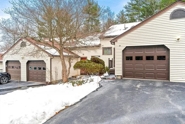 a view of a house with a snow in the yard
