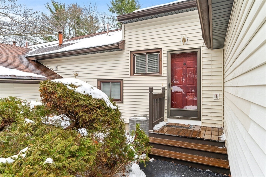 14 Centercrest Drive, Unit 14 Tyngsborough, MA 01879 - Photo 3 of 27 a side view of a house with a yard