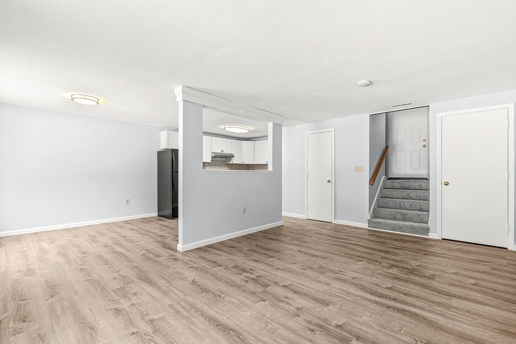 14 Centercrest Drive, Unit 14 Tyngsborough, MA 01879 - Photo 6 of 27 a view of empty room with wooden floor