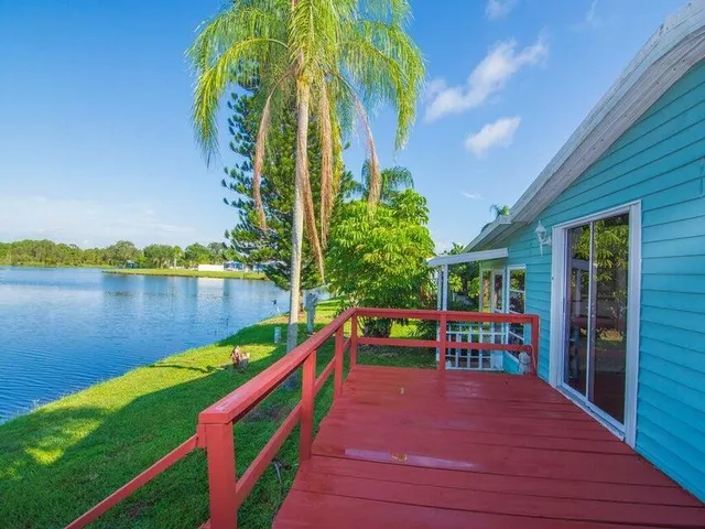 swimming pool view with a lake view