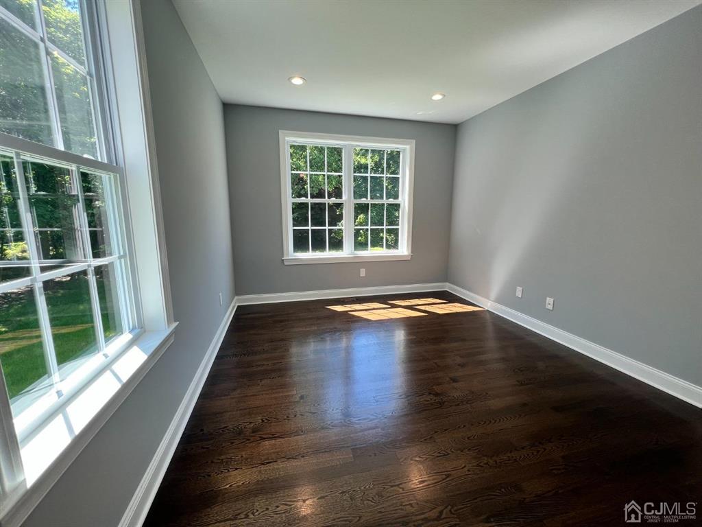 133 Old Beekman Road Monmouth Junction, NJ 08852 - Photo 14 of 42 a view of empty room with wooden floor and fan
