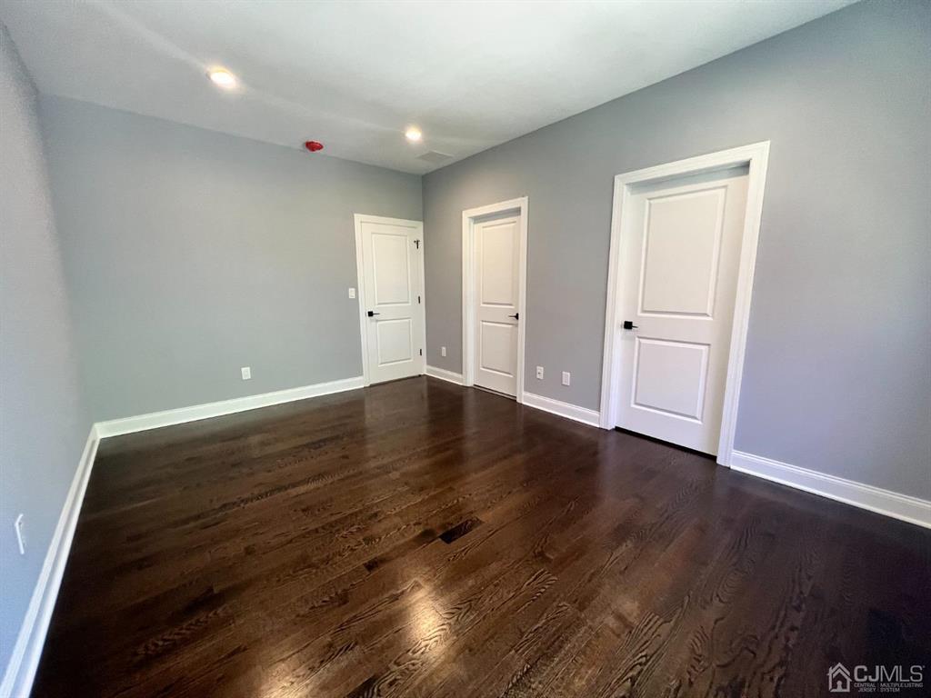 133 Old Beekman Road Monmouth Junction, NJ 08852 - Photo 20 of 42 a view of room with wooden floor and window