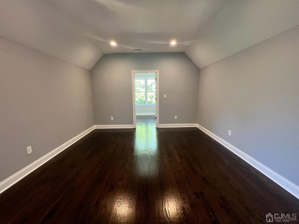 133 Old Beekman Road Monmouth Junction, NJ 08852 - Photo 25 of 42 an empty room with wooden floor and windows