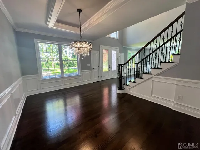 a view of room with window and hardwood floor