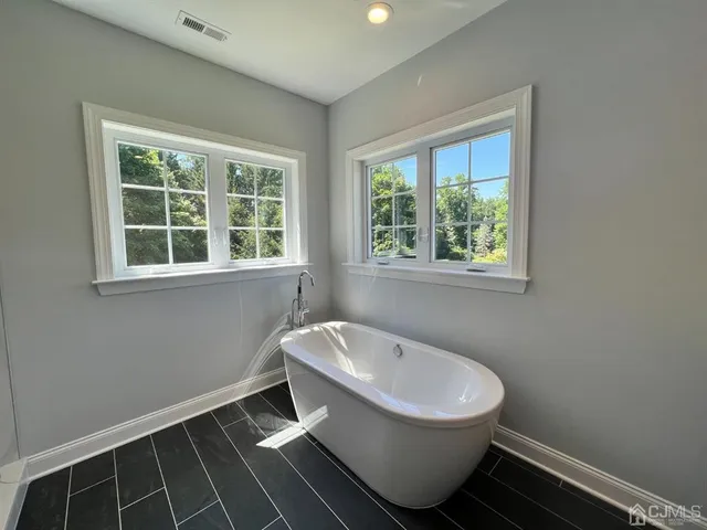 a bathroom with a sink and window