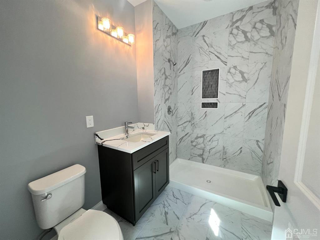 133 Old Beekman Road Monmouth Junction, NJ 08852 - Photo 34 of 42 a bathroom with a sink toilet and shower