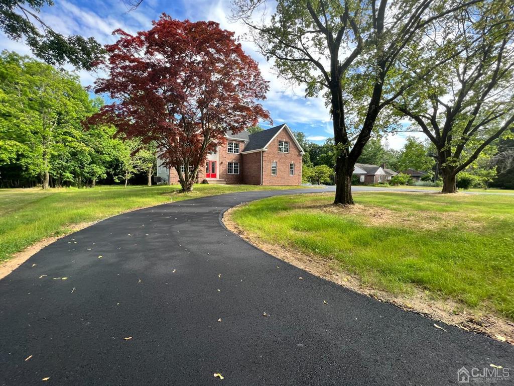 133 Old Beekman Road Monmouth Junction, NJ 08852 - Photo 39 of 42 a view of a house with a big yard and large tree