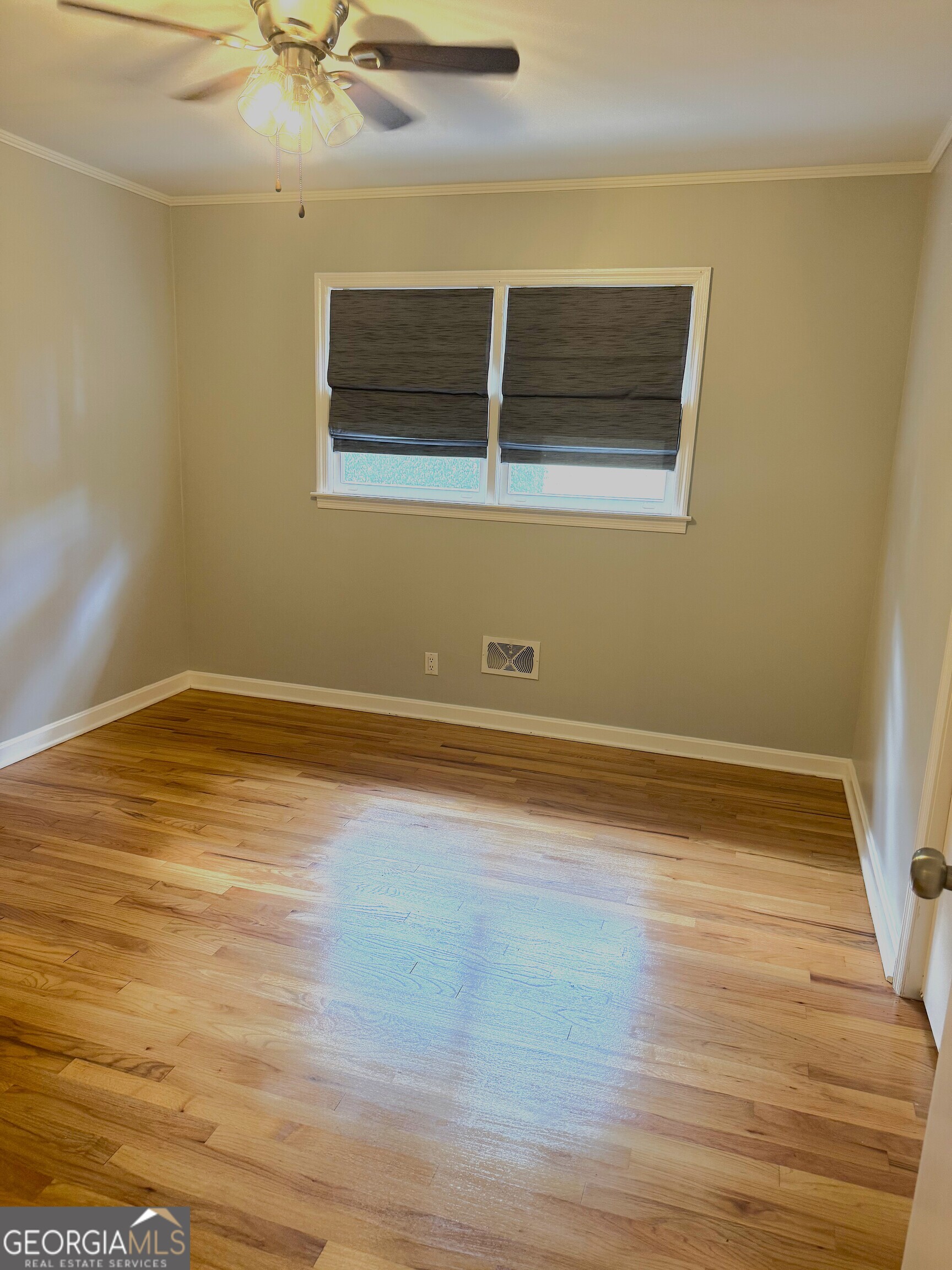 819 Ellenwood Circle Macon, GA 31204 - Photo 11 of 17 a view of a room with wooden floor and white walls