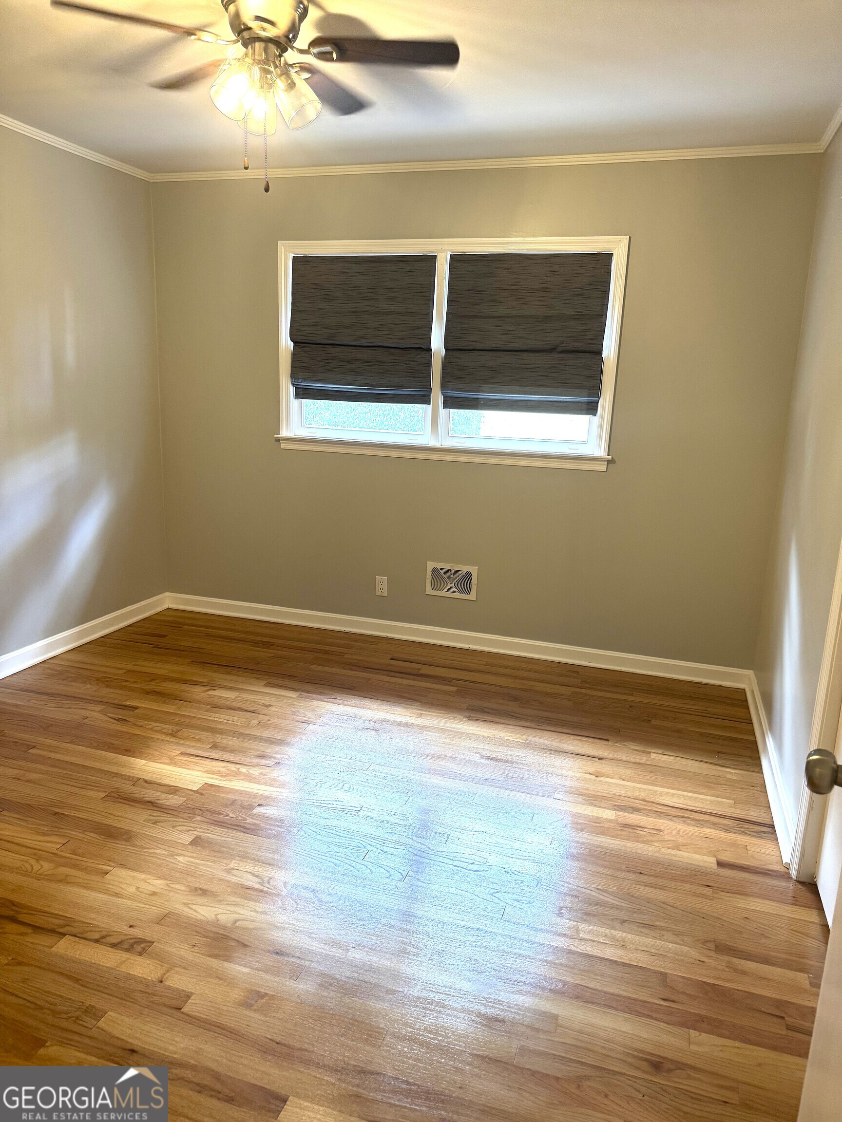 819 Ellenwood Circle Macon, GA 31204 - Photo 12 of 17 a view of a room with wooden floor and ceiling fan