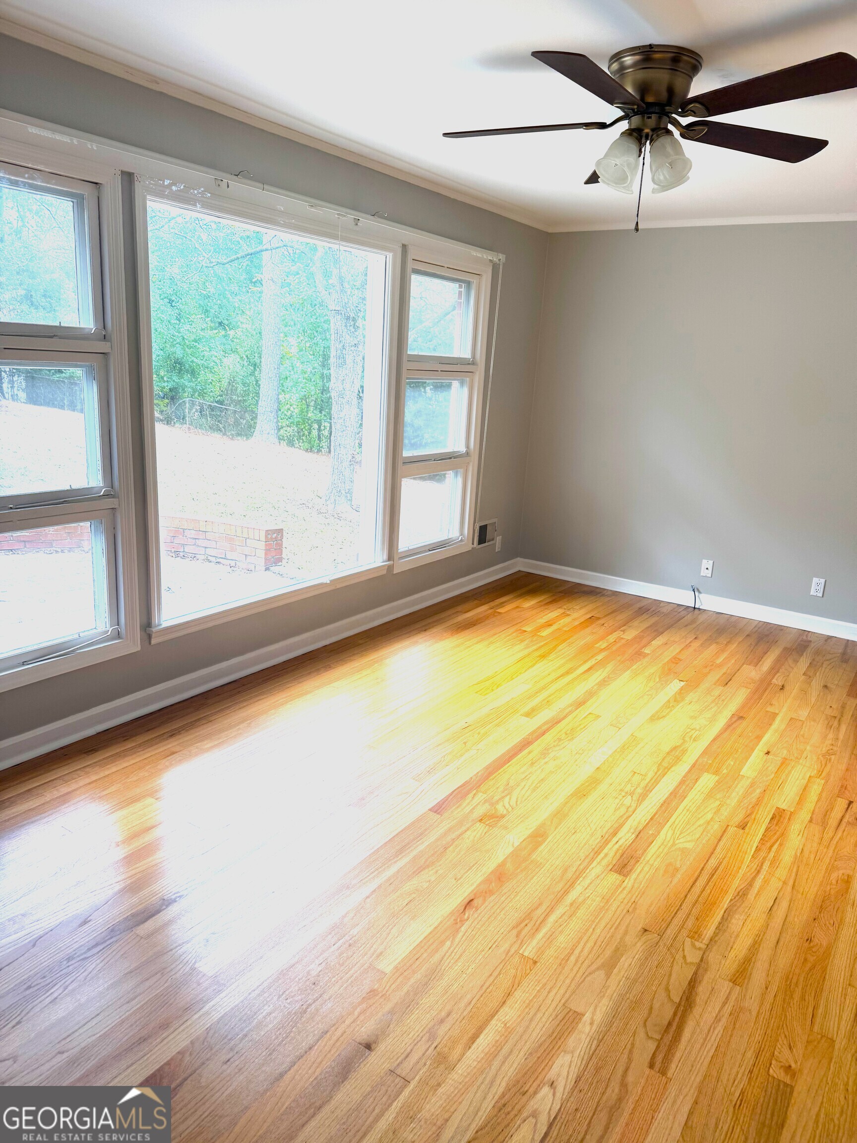819 Ellenwood Circle Macon, GA 31204 - Photo 8 of 17 a view of empty room with wooden floor and fan