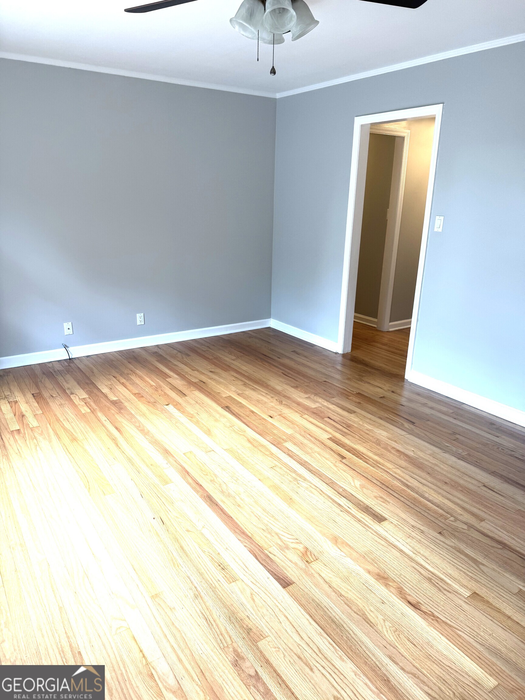 819 Ellenwood Circle Macon, GA 31204 - Photo 9 of 17 a view of a room has wooden floor and a ceiling fan