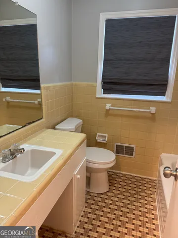 a bathroom with a sink and a toilet