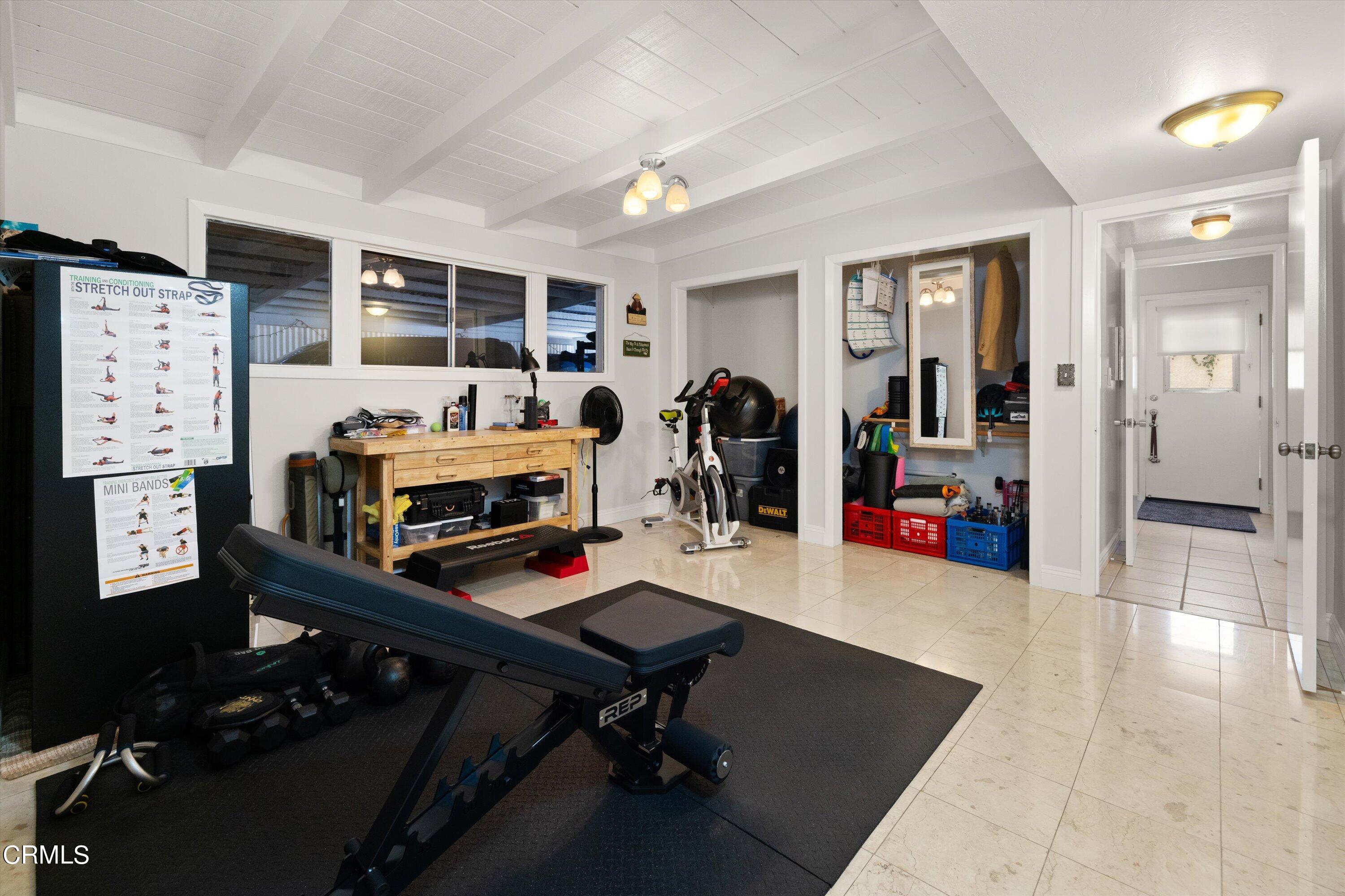 683 Maple Avenue Carpinteria, CA 93013 - Photo 19 of 39 a room with furniture and gym equipment