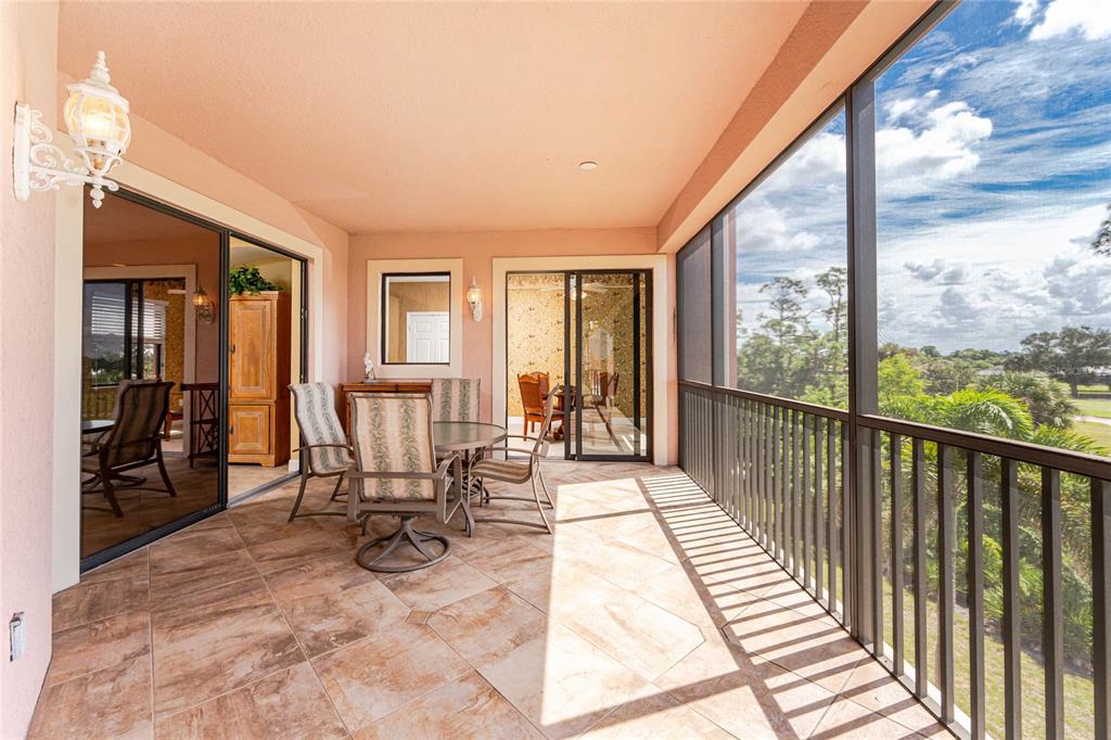 24351 Baltic Avenue, Unit 203 Punta Gorda, FL 33955 - Photo 18 of 51 a view of a balcony with chairs