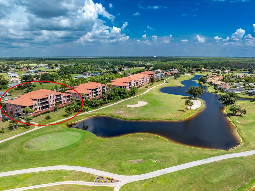 24351 Baltic Avenue, Unit 203 Punta Gorda, FL 33955 - Photo 2 of 51 a view of a pool a fountain lake and ocean view