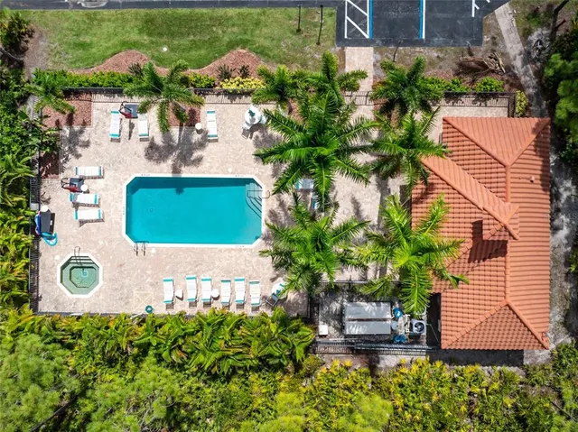 an aerial view of a house with garden space and street view