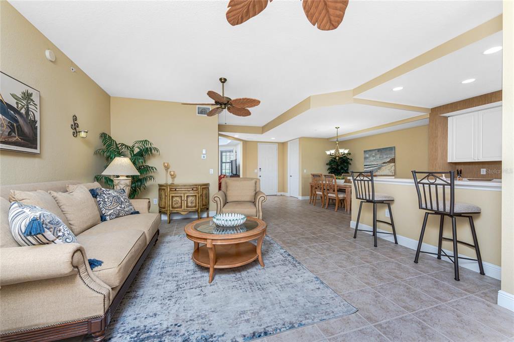 24351 Baltic Avenue, Unit 203 Punta Gorda, FL 33955 - Photo 6 of 51 a living room with furniture and a table