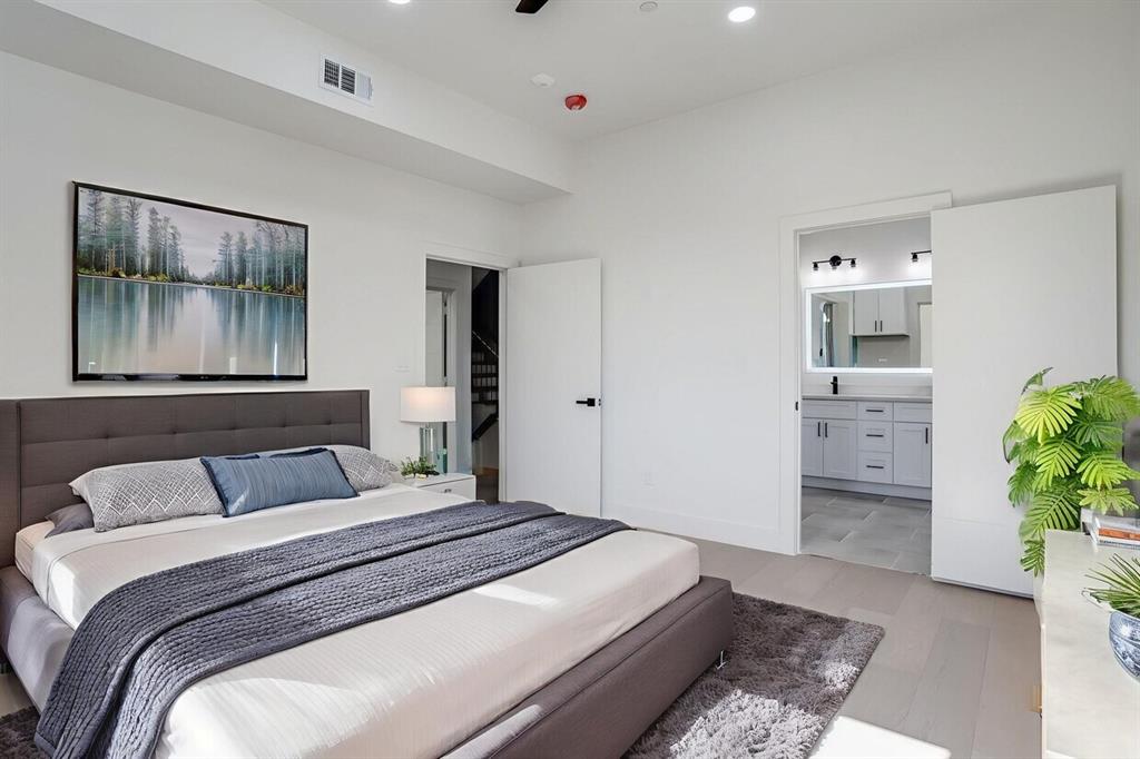 6001 Lewis Street Dallas, TX 75206 - Photo 12 of 19 a bedroom with a bed and a couch