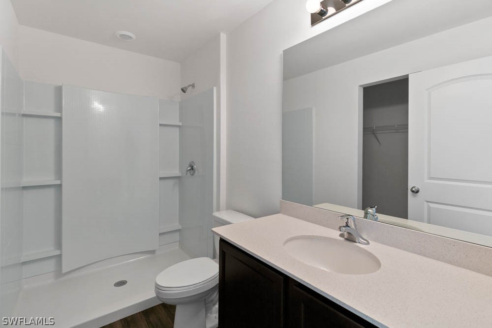840 Rue Labeau Circle Fort Myers, FL 33913 - Photo 5 of 5 a bathroom with a sink toilet and shower
