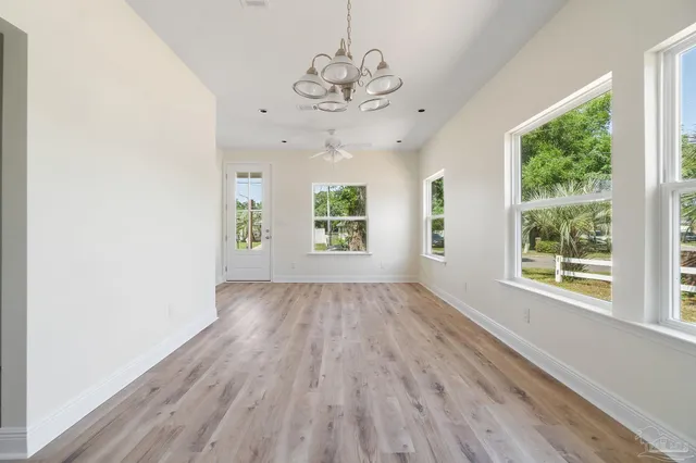 a kitchen with a refrigerator a sink and cabinets