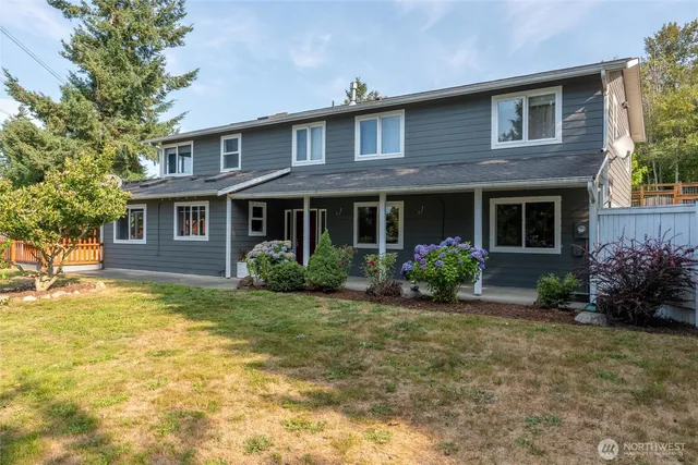 a front view of a house with garden