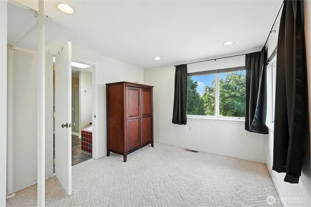a bathroom with a tub and shower