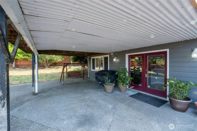 a view of a balcony with wooden floor