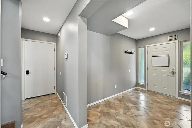 wooden floor in an empty room and a window