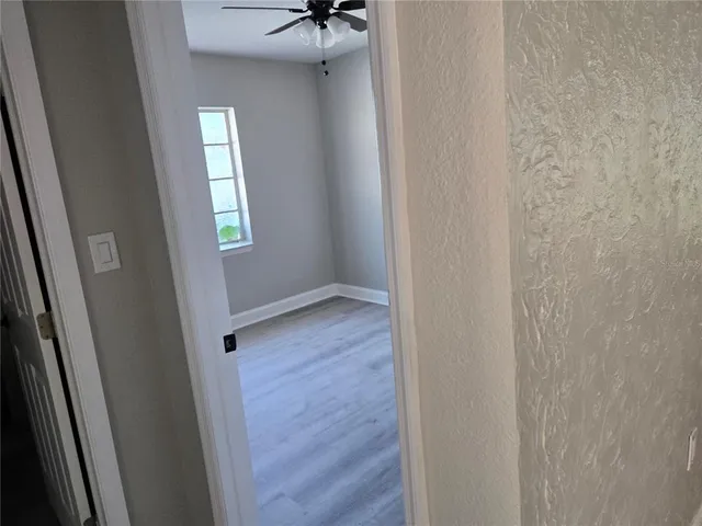 a view of an empty room with a window