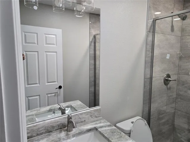 a bathroom with a sink and shower