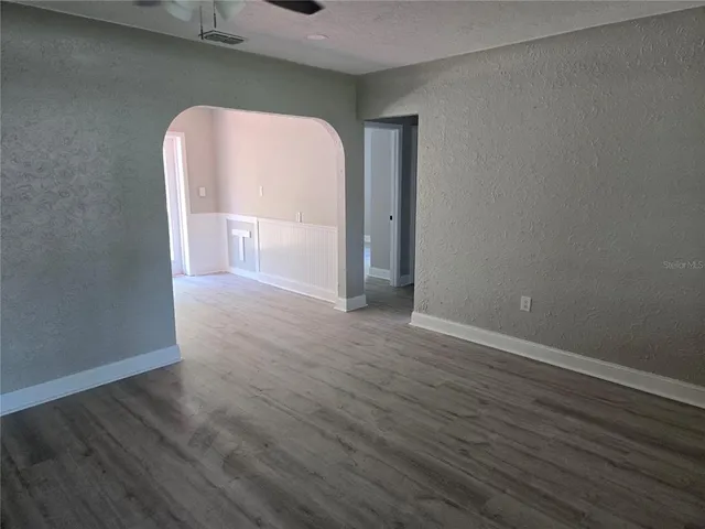 a view of a livingroom with wooden floor