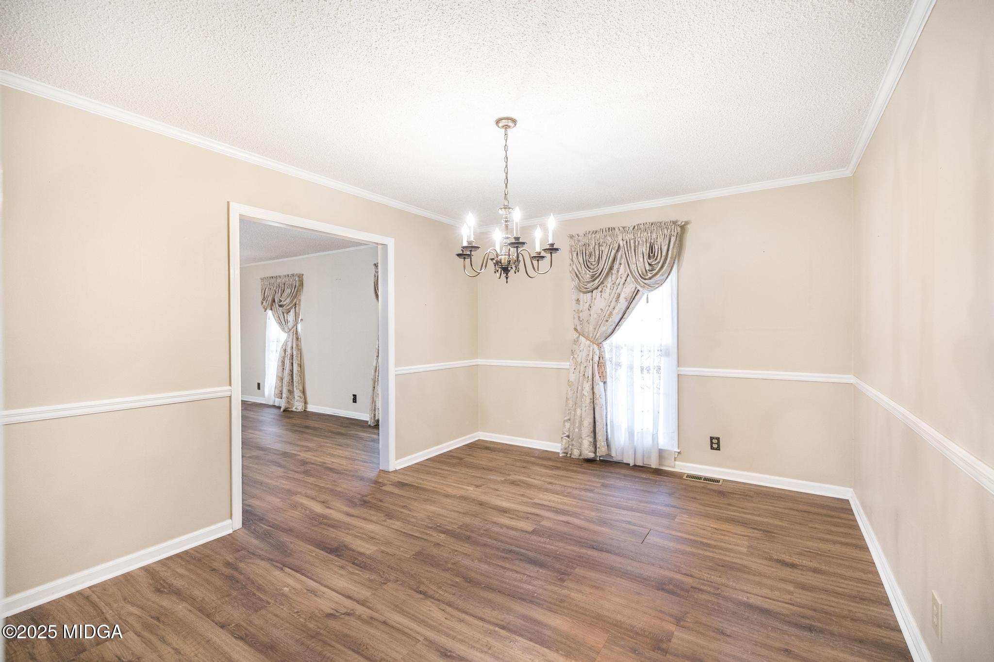 5812 Sardis Church Road Macon, GA 31216 - Photo 15 of 43 wooden floor in an empty room with a window