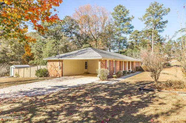 a house with trees in front of it
