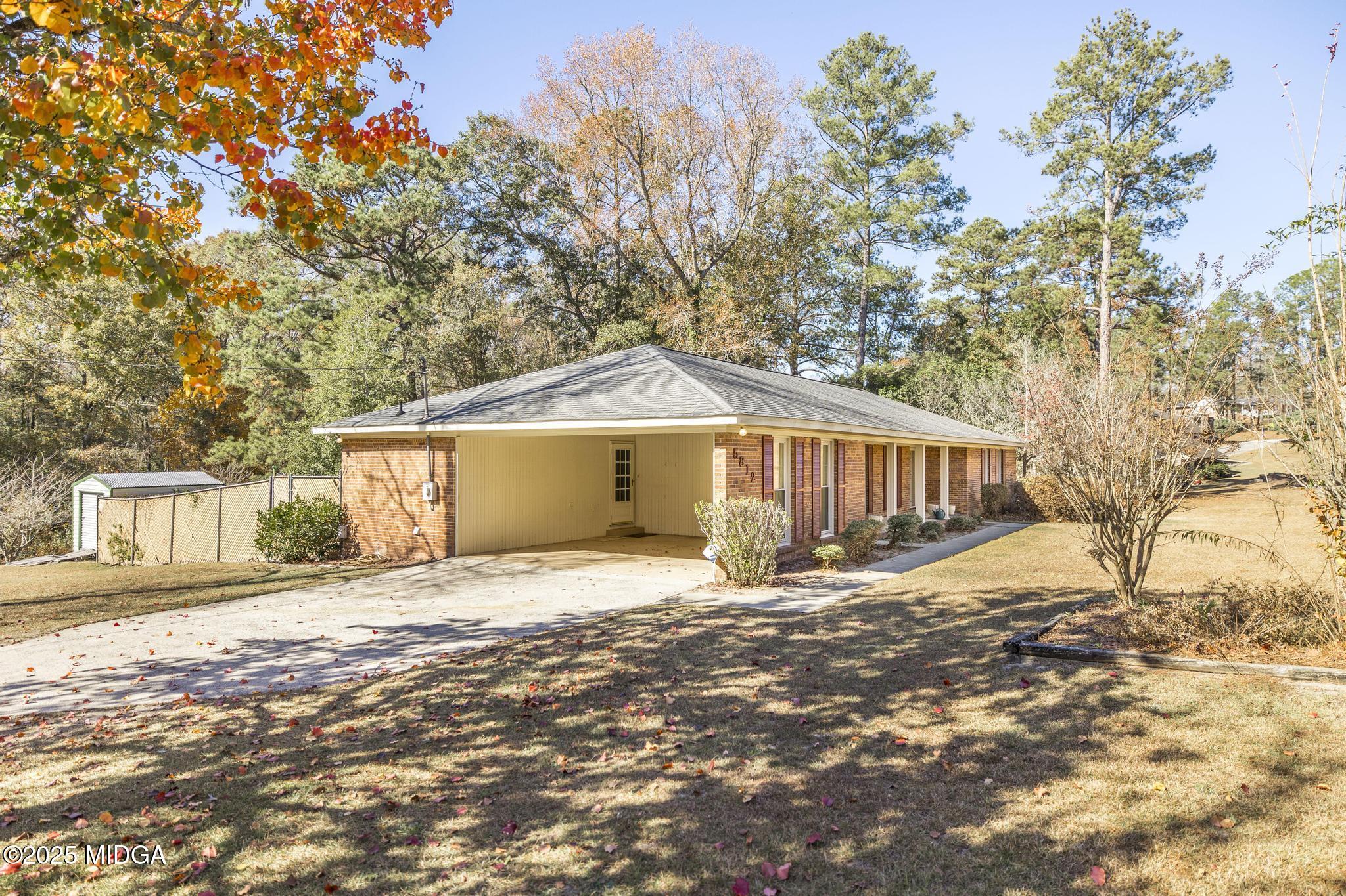 5812 Sardis Church Road Macon, GA 31216 - Photo 2 of 43 a house with trees in front of it